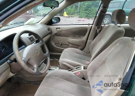 2001 Toyota Corolla Ce z USA, uszkodzony, nr VIN 2T1BR12E11C435727